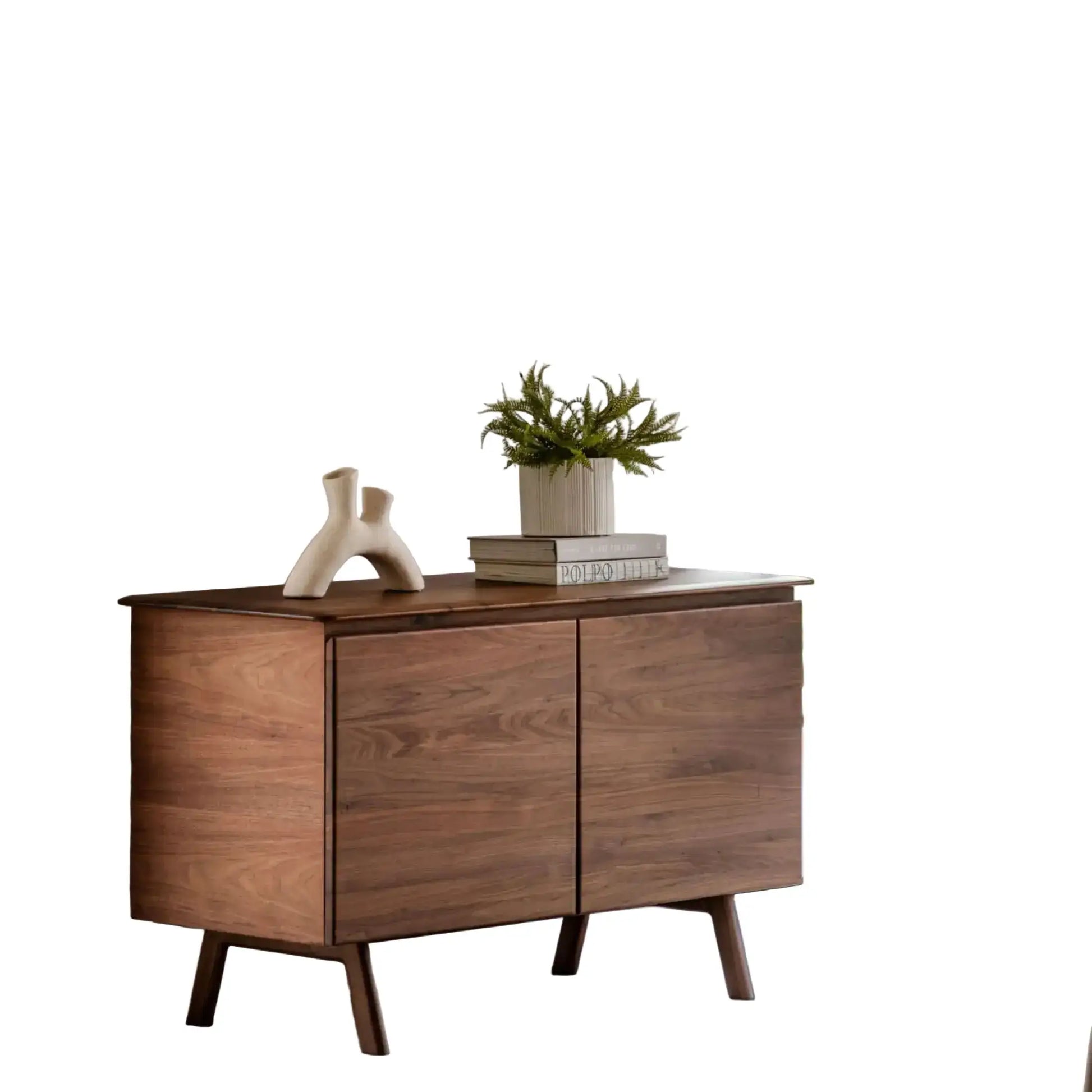 Wooden sideboard with decorative items on a white background