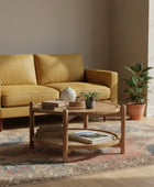 Wooden coffee table with decorative items on a white background
