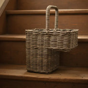 Wicker basket on a wooden staircase