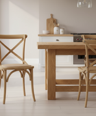 Wooden dining table with chairs in a kitchen setting