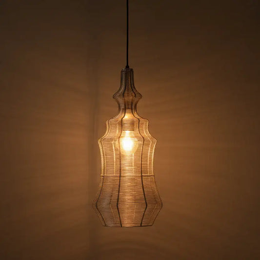 Decorative pendant light with a warm glow against a brown background