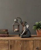 sitting-elephant-holding-a-lantern-the-farthing-1