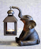 Sitting Elephant Holding a Lantern - The Farthing