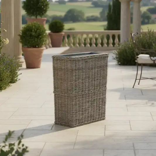Outdoor patio with wicker planter, chairs, and scenic view